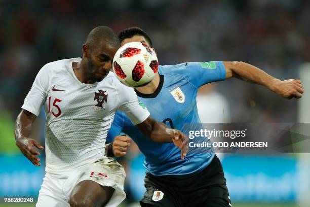 Uruguay's forward Luis Suarez vies for the ball with Portugal's defender Ricardo Pereira during the Russia 2018 World Cup round of 16 football match...