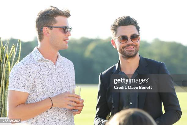 Jeremy Irvine and Dominic Cooper attend the Audi Polo Challenge at Coworth Park Polo Club on June 30, 2018 in Ascot, England.