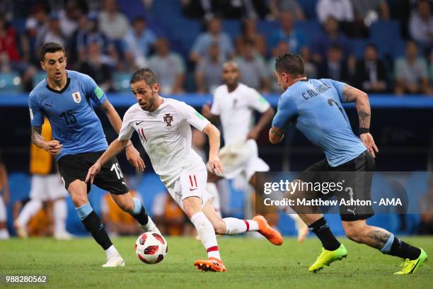 Matias Vecino of Uruguay and Cristian Rodriguez of Uruguay compete with Bernardo Silva of Portugal during the 2018 FIFA World Cup Russia Round of 16...