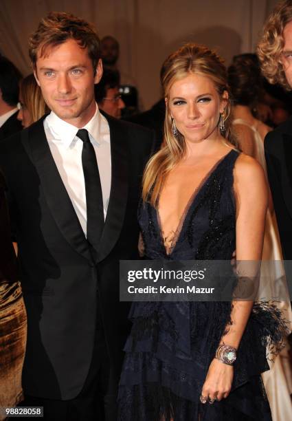 Jude Law and Sienna Miller attends the Costume Institute Gala Benefit to celebrate the opening of the "American Woman: Fashioning a National...