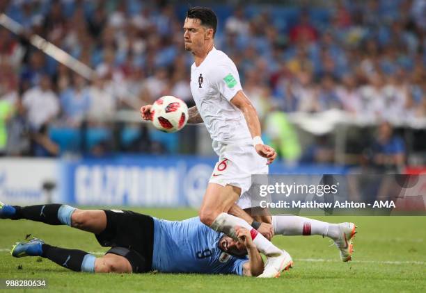 Jose Fonte of Portugal tangles with Luis Suarez of Uruguay during the 2018 FIFA World Cup Russia Round of 16 match between Uruguay and Portugal at...