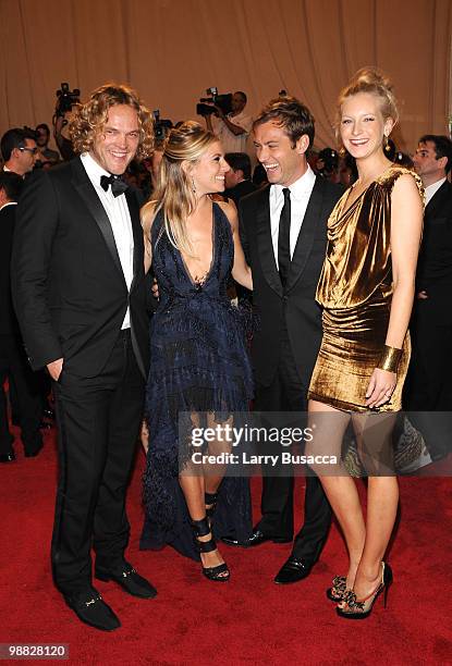 Designer Peter Dundas, actress Sienna Miller, actor Jude Law and guest attend the Costume Institute Gala Benefit to celebrate the opening of the...