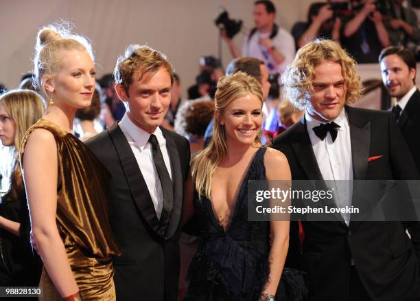 Designer Savannah Miller, actor Jude Law, actress Sienna Miller and designer Peter Dundas attend the Costume Institute Gala Benefit to celebrate the...