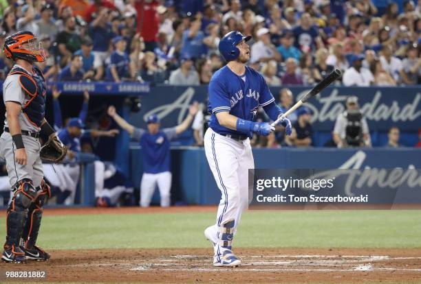 Justin Smoak of the Toronto Blue Jays hits a game-winning solo home run in the ninth inning during MLB game action against the Detroit Tigers at...