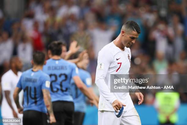 Cristiano Ronaldo of Portugal looks dejected as his team are eliminated at the end of the 2018 FIFA World Cup Russia Round of 16 match between...