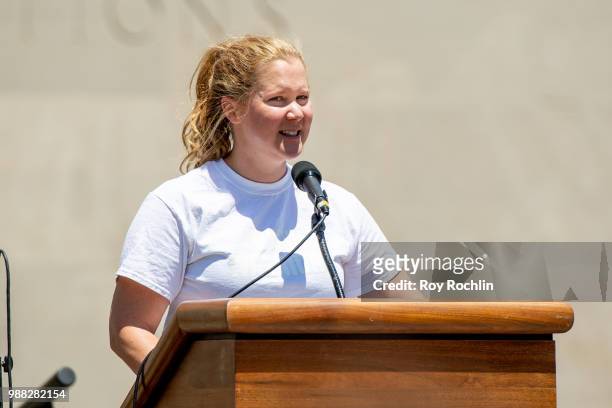 Amy Schumer on stage during the Families Belong Together Rally and March in New York City on June 30, 2018 in New York City.