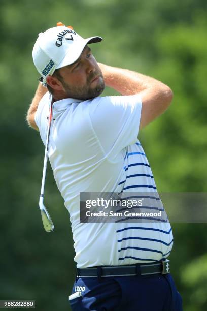 Marc Leishman of Australia hits off the fourth tee during the third round of the Quicken Loans National at TPC Potomac on June 30, 2018 in Potomac,...