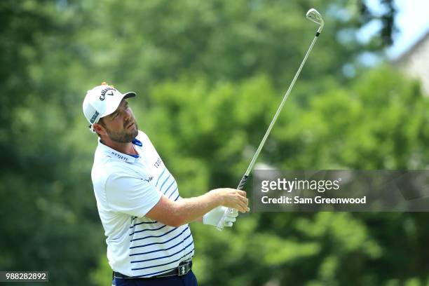 Marc Leishman of Australia hits off the fourth tee during the third round of the Quicken Loans National at TPC Potomac on June 30, 2018 in Potomac,...