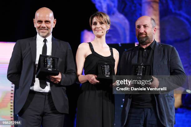 Riccardo Milani, Paola Cortellesi and Antonio Albanese are awarded during the Nastri D'Argento Award Ceremony on June 30, 2018 in Taormina, Italy.