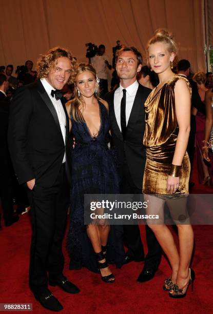 Designer Peter Dundas, actress Sienna Miller, actor Jude Law and designer Savannah Miller attend the Costume Institute Gala Benefit to celebrate the...