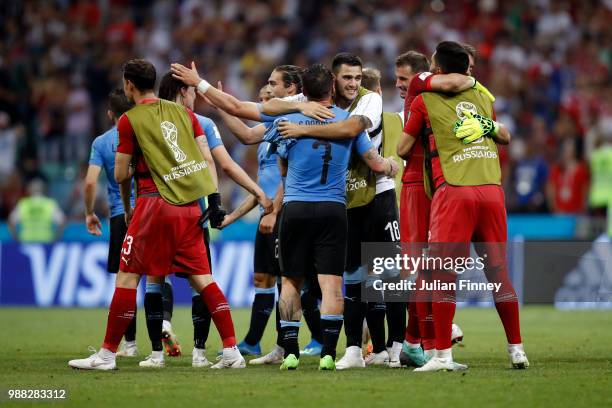 Uruguay players celebrate their victory following the 2018 FIFA World Cup Russia Round of 16 match between Uruguay and Portugal at Fisht Stadium on...