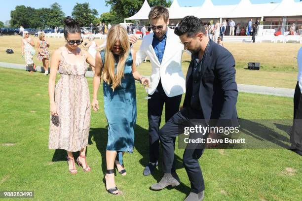 Bel Powley, guest, Douglas Booth and Dominic Cooper attend the Audi Polo Challenge at Coworth Park Polo Club on June 30, 2018 in Ascot, England.