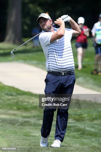Marc Leishman of Australia plays a shot on the sixth hole during the third round of the Quicken Loans National at TPC Potomac on June 30, 2018 in...