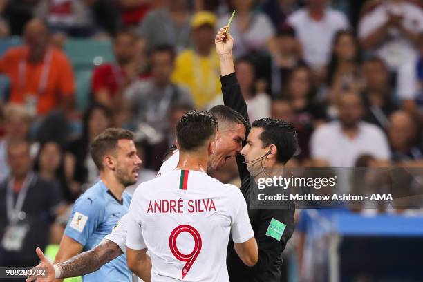 Cristiano Ronaldo of Portugal reacts as he is shown a yellow card by Referee Cesar Ramos during the 2018 FIFA World Cup Russia Round of 16 match...