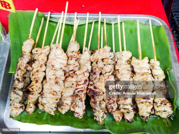 delicious asian cuisine, traditional thai chicken satay cooking - chicken satay stock pictures, royalty-free photos & images