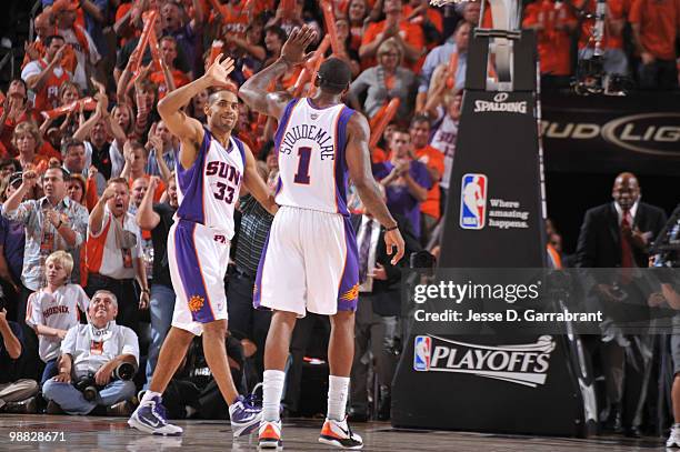 Grant Hill and Amar'e Stoudemire of the Phoenix Suns celebrate against the San Antonio Spurs in Game One of the Western Conference Semifinals during...