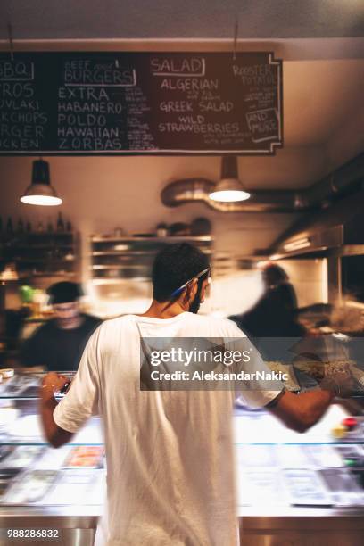 taking orders - packed restaurant stock pictures, royalty-free photos & images