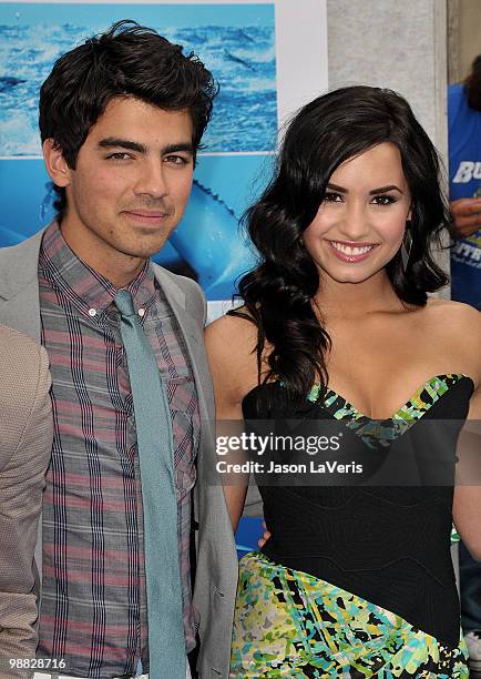 Joe Jonas and Demi Lovato attend the premiere of "Oceans" at the El Capitan Theatre on April 17, 2010 in Hollywood, California.
