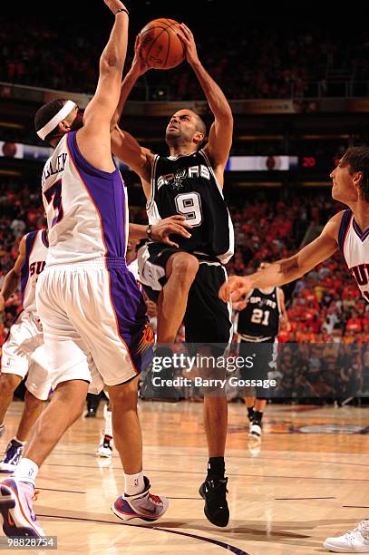 Tony Parker of the San Antonio Spurs puts a shot up against Jared Dudley of the Phoenix Suns in Game One of the Western Conference Semifinals during...