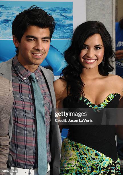 Joe Jonas and Demi Lovato attend the premiere of "Oceans" at the El Capitan Theatre on April 17, 2010 in Hollywood, California.