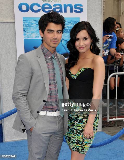 Joe Jonas and Demi Lovato attend the premiere of "Oceans" at the El Capitan Theatre on April 17, 2010 in Hollywood, California.