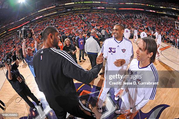 Tim Duncan of the San Antonio Spurs shakes hands with Grant Hill of the Phoenix Suns in Game One of the Western Conference Semifinals during the 2010...