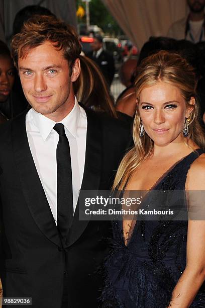 Actor Jude Law and actress Sienna Miller attend the Costume Institute Gala Benefit to celebrate the opening of the "American Woman: Fashioning a...