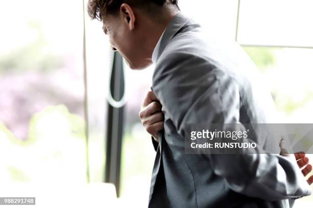 middle aged businessman with chest pain - hjärtattack bildbanksfoton och bilder
