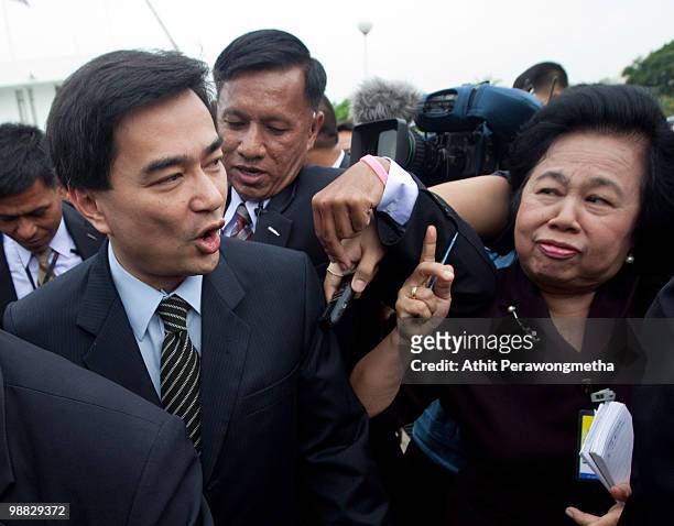 Thai Prime Minister Abhisit Vejjajiva answers questions from media as he arrives for a cabinet meeting at the 11th Infantry Regiment on May 4, 2010...