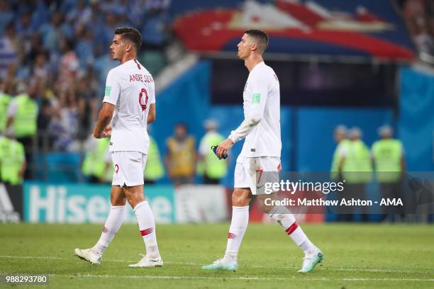 Cristiano Ronaldo of Portugal looks dejected with Andre Silva of Portugal at the end of the 2018 FIFA World Cup Russia Round of 16 match between...