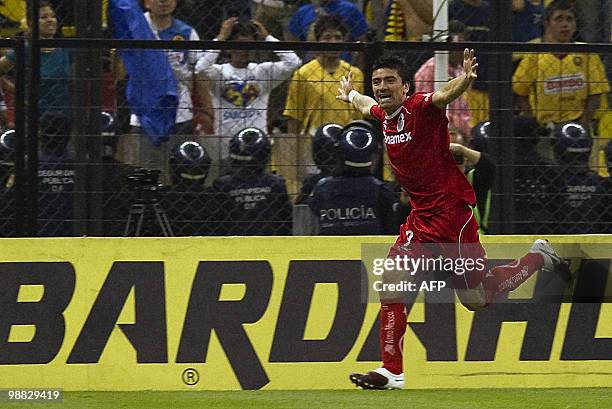 Toluca's Hector Mancilla celebrates after scoring against America during their Mexican football league Bicentenary Tournament match in Mexico City on...