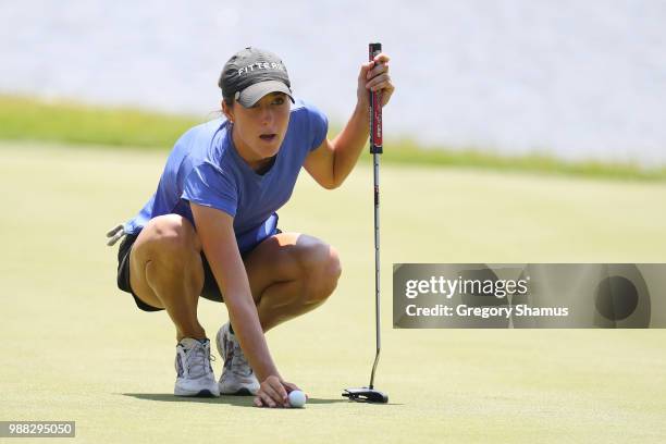 Jaye Marie Green reads a putt on the third green during the final round of the 2018 KPMG PGA Championship at Kemper Lakes Golf Club on June 30, 2018...