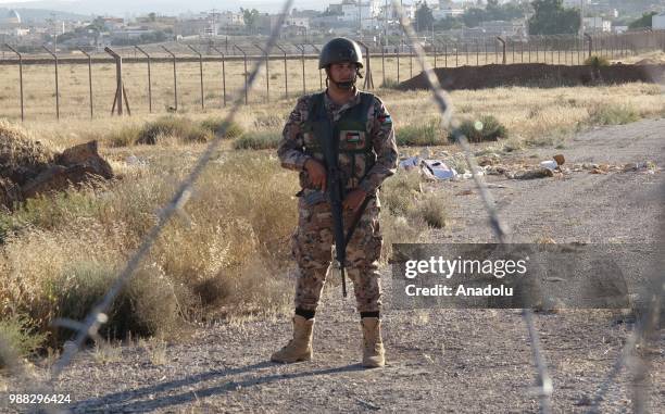 Jordanian soldiers take security measures as they do not let any Syrians to cross the border after Syrians fled from the ongoing military operations...