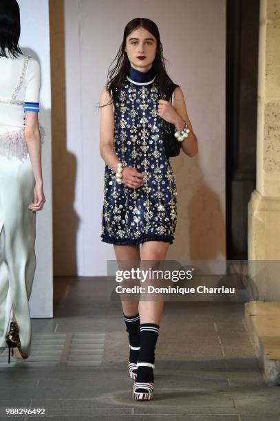 Model walks the runway during Miu Miu 2019 Cruise Collection Show at Hotel Regina on June 30, 2018 in Paris, France.