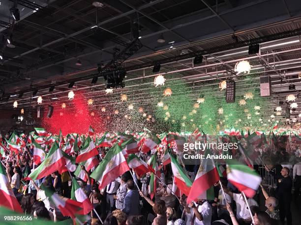 Thousands of Iranians gather during the event organized by National Council of Resistance of Iran at the Parc des Expositions de Villepinte in Paris,...