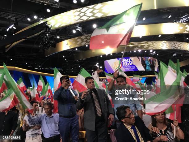 Thousands of Iranians gather during the event organized by National Council of Resistance of Iran at the Parc des Expositions de Villepinte in Paris,...