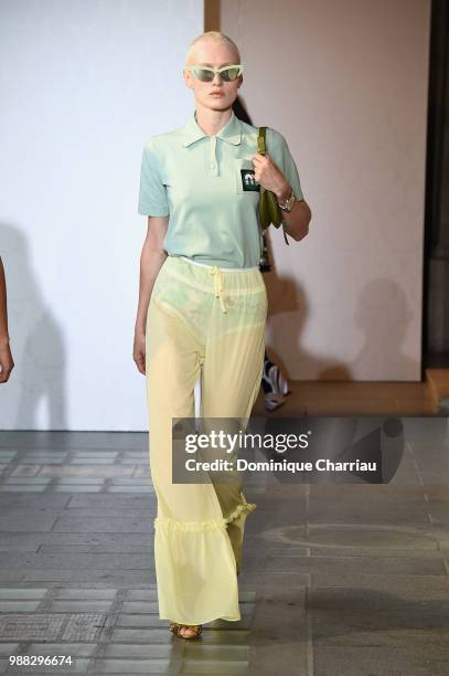 Model walks the runway during Miu Miu 2019 Cruise Collection Show at Hotel Regina on June 30, 2018 in Paris, France.