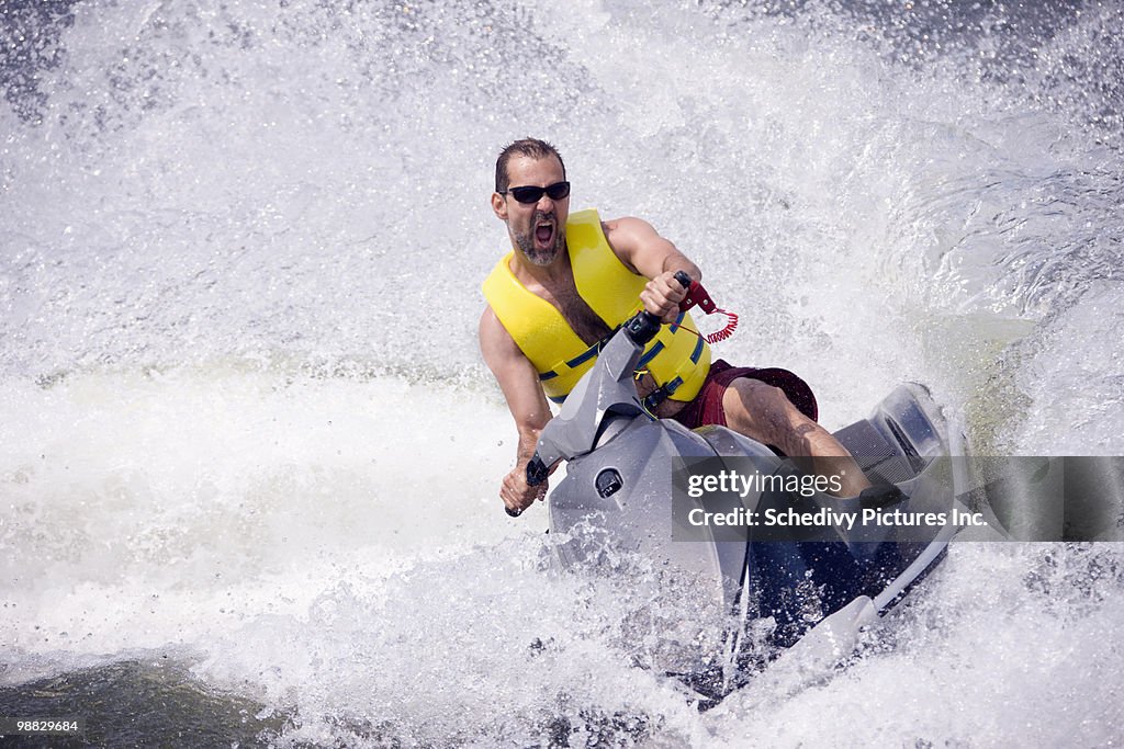 Man on jet ski on lake
