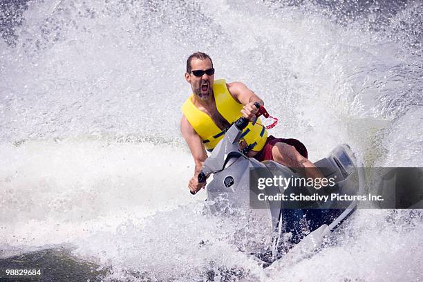 man on jet ski on lake  - jet ski ストックフォトと画像