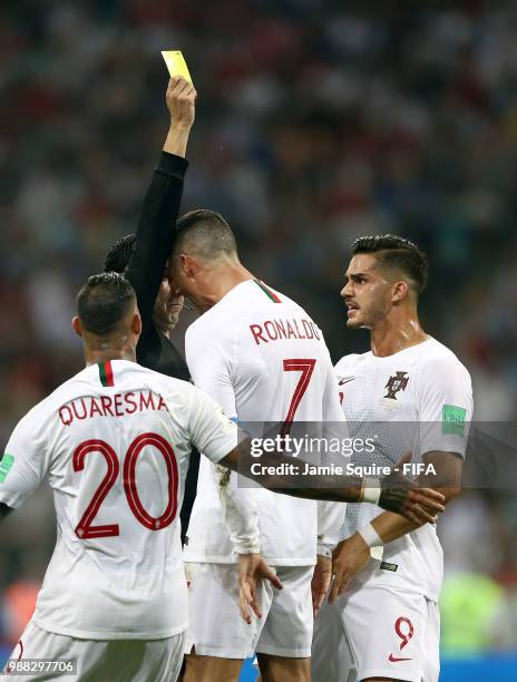 Cristiano Ronaldo of Portugal is given a yellow card during the final minutes of the 2018 FIFA World Cup Russia Round of 16 match between Uruguay and...