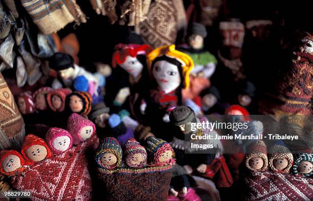 dolls in distinctive andean fabric. bolivia - cuban doll stock-fotos und bilder