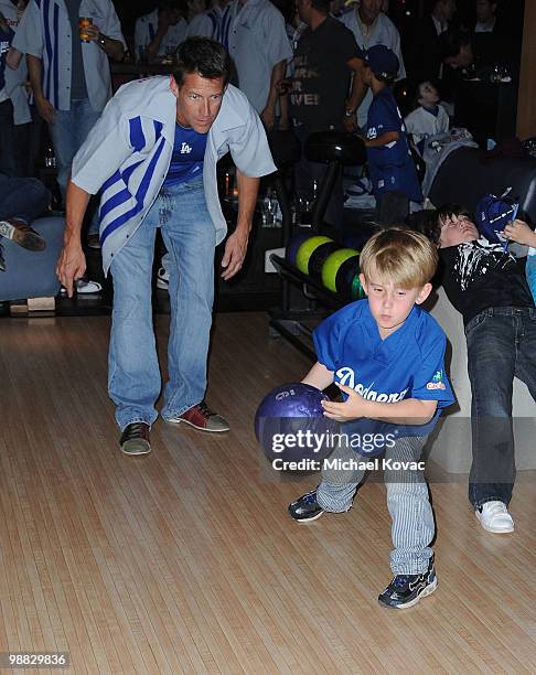 Actor James Denton watches as his son Sheppard bowls at the 6th Annual State Farm Dodgers Dream Foundation Bowling Extravaganza at Lucky Strike Lanes...