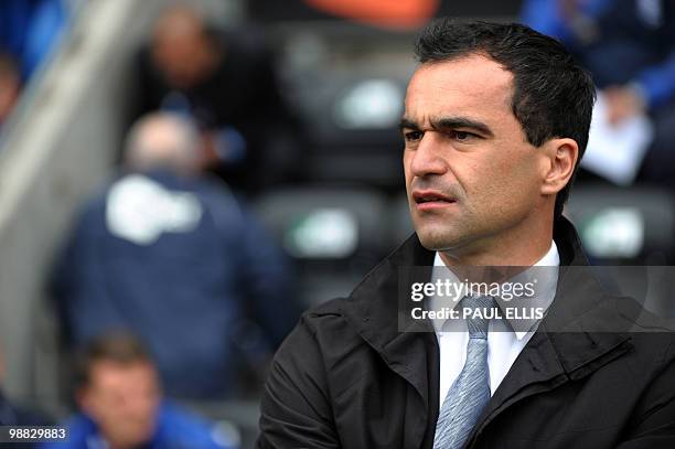 Wigan Athletic's Spanish manager Roberto Martinez watches during their English Premier League football match against Hull City at The DW Stadium in...