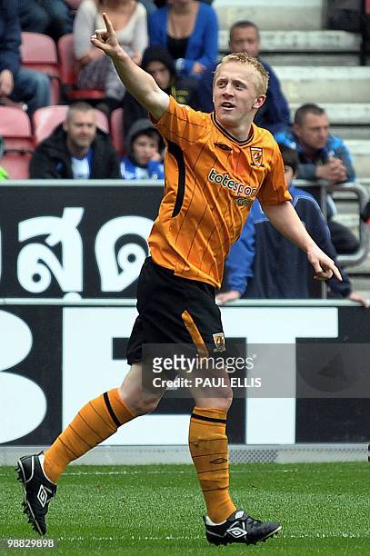 Hull City's Mark Cullen scores their second goal during their English Premier League football match against Wigan Athletic at The DW Stadium in...