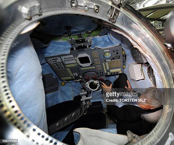 German astronaut Ulf Merbold sits onboard the reentry module of the Soyuz TM-19 mission, in which he turned back to Earth from the MIR space station...