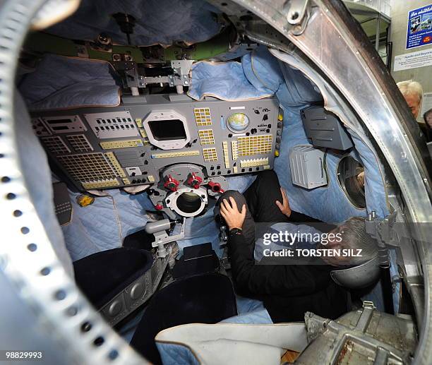 German astronaut Ulf Merbold sits onboard the reentry module of the Soyuz TM-19 mission, in which he turned back to Earth from the MIR space station...