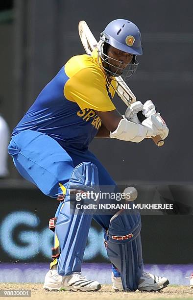 Sri Lankan cricketer Thissara Perera plays a shot against Zimbabwe during their ICC T20 World Cup match at the Providence Stadium in Guyana on May 3,...