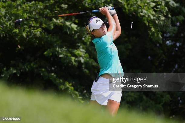 Danielle Kang watches her drive on the fourth hole during the final round of the 2018 KPMG PGA Championship at Kemper Lakes Golf Club on June 30,...