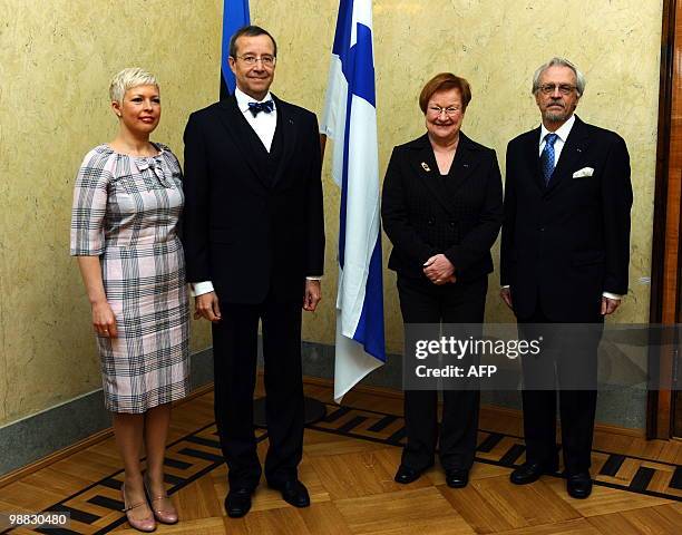 Finnish President Tarja Halonen and her husband, Pentti Arajarvi , pose with her Estonian counterpart Toomas Hendrik Ilves and his wife on May 4,...