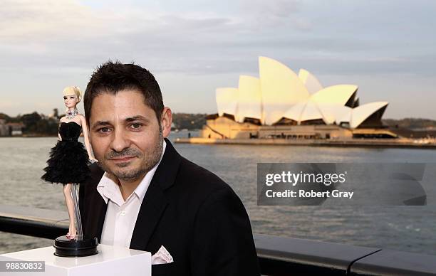 Jewellery designer Stefano Canturi poses with the world's most expensive Barbie doll at the Barbie Basics Collection Launch during Rosemount...